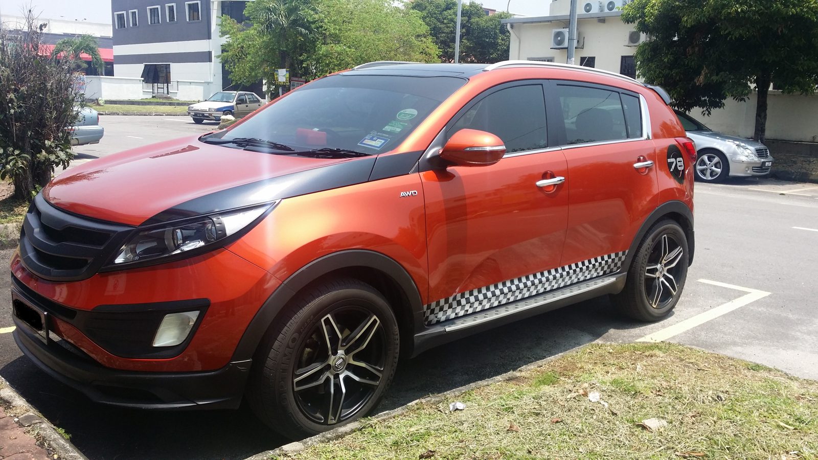 Orange Kia vehicle