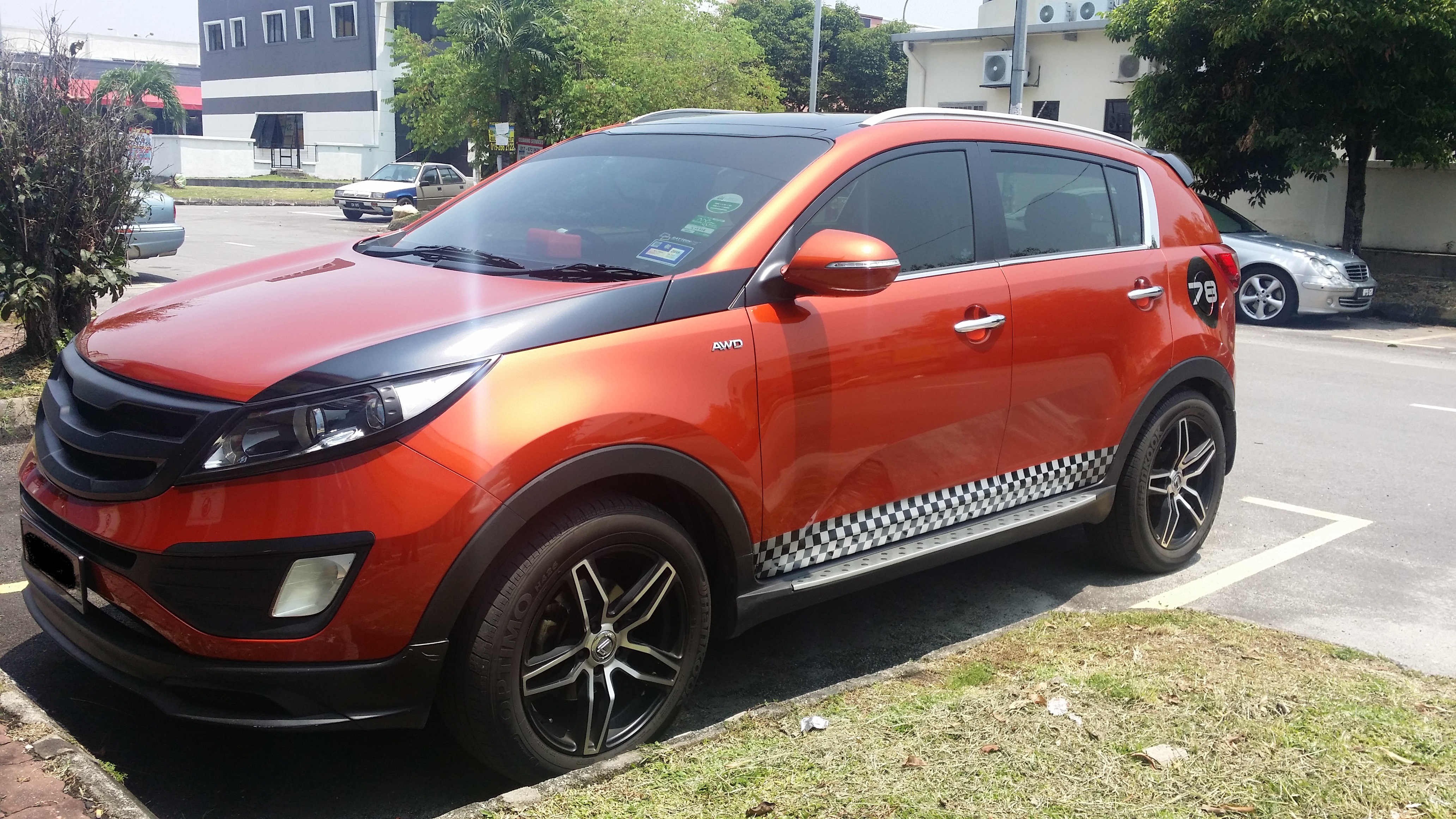 Modified orange Kia Sportage